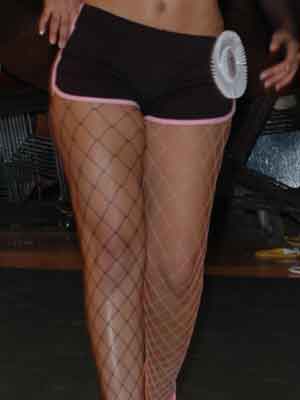 Diamond net tights, one leg black, one leg pink.