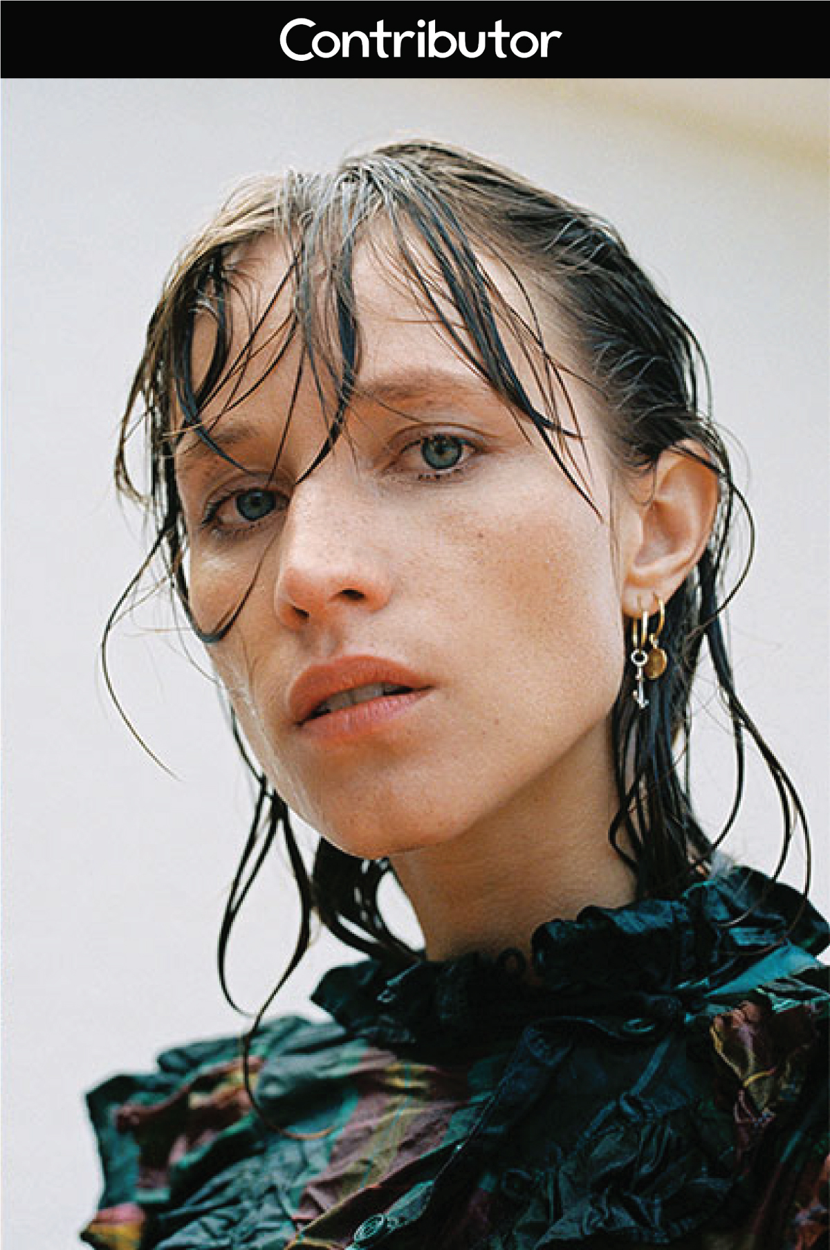 model with wet hair on a grey background portrait