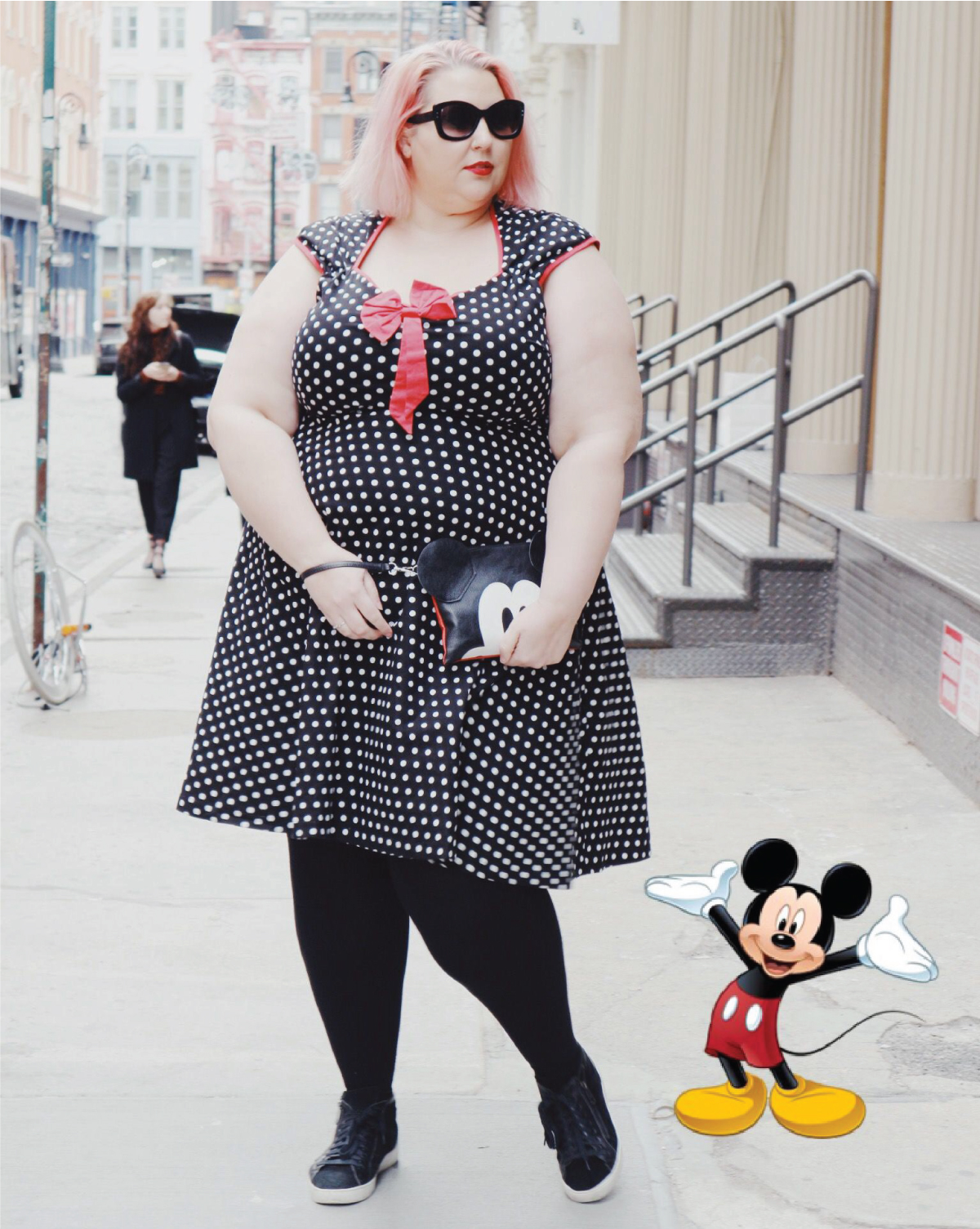 Fashion blogger standing on the street wearing a Disneybound Mickey Mouse inspired outfit