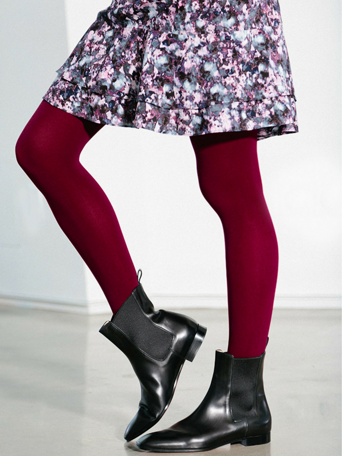 maroon tights with flower skirt and black boots
