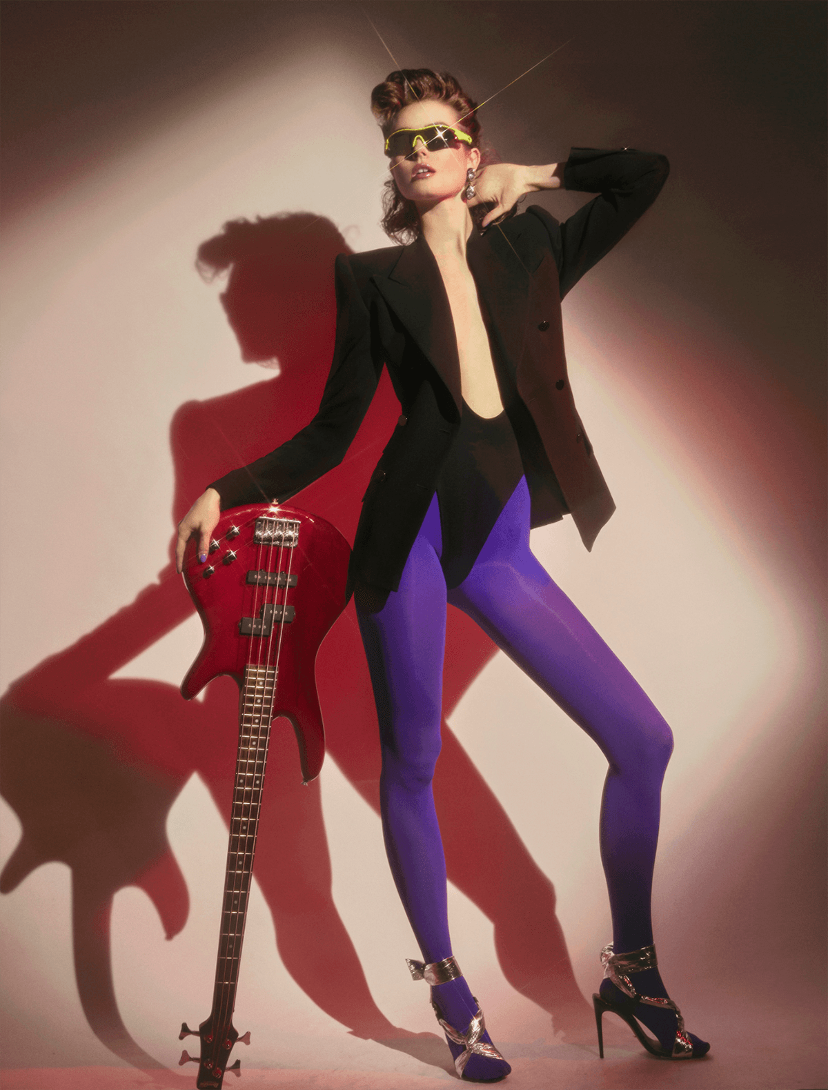 woman with guitar wearing violet tights
