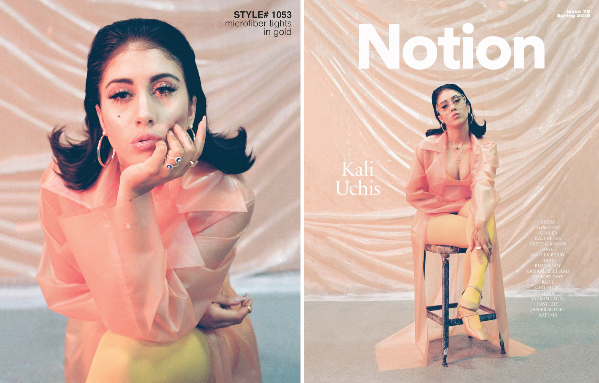 Singer Kali Uchis sitting on a chair with a pink background behind