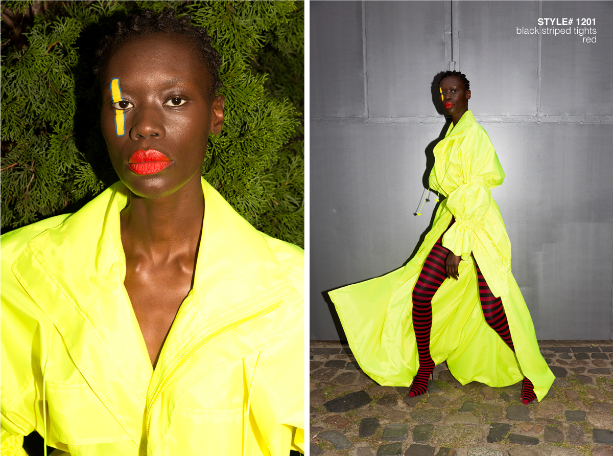 female model wearing a neon dress and red striped tights