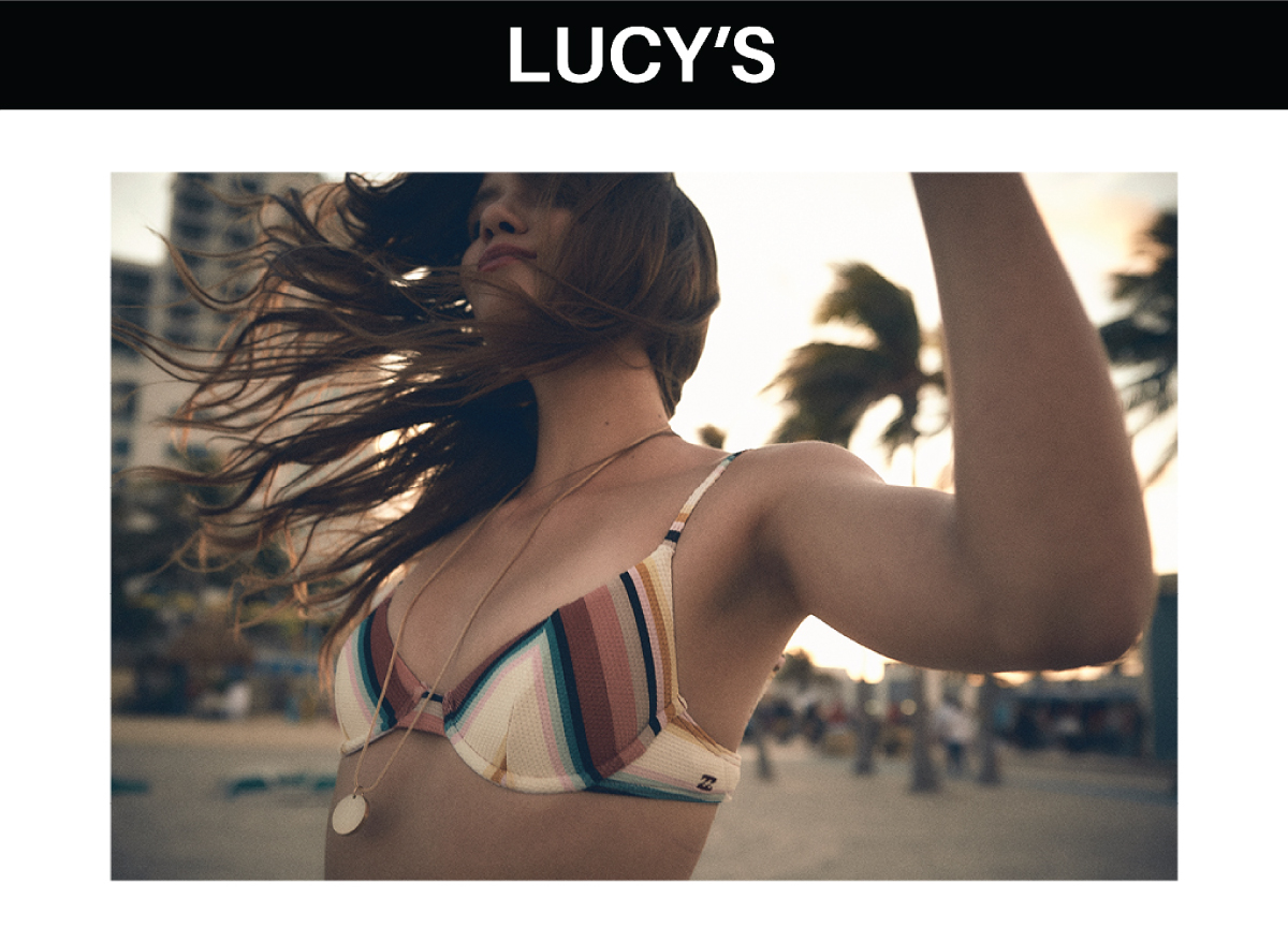 Model standing on the beach in a bathing suit in motion