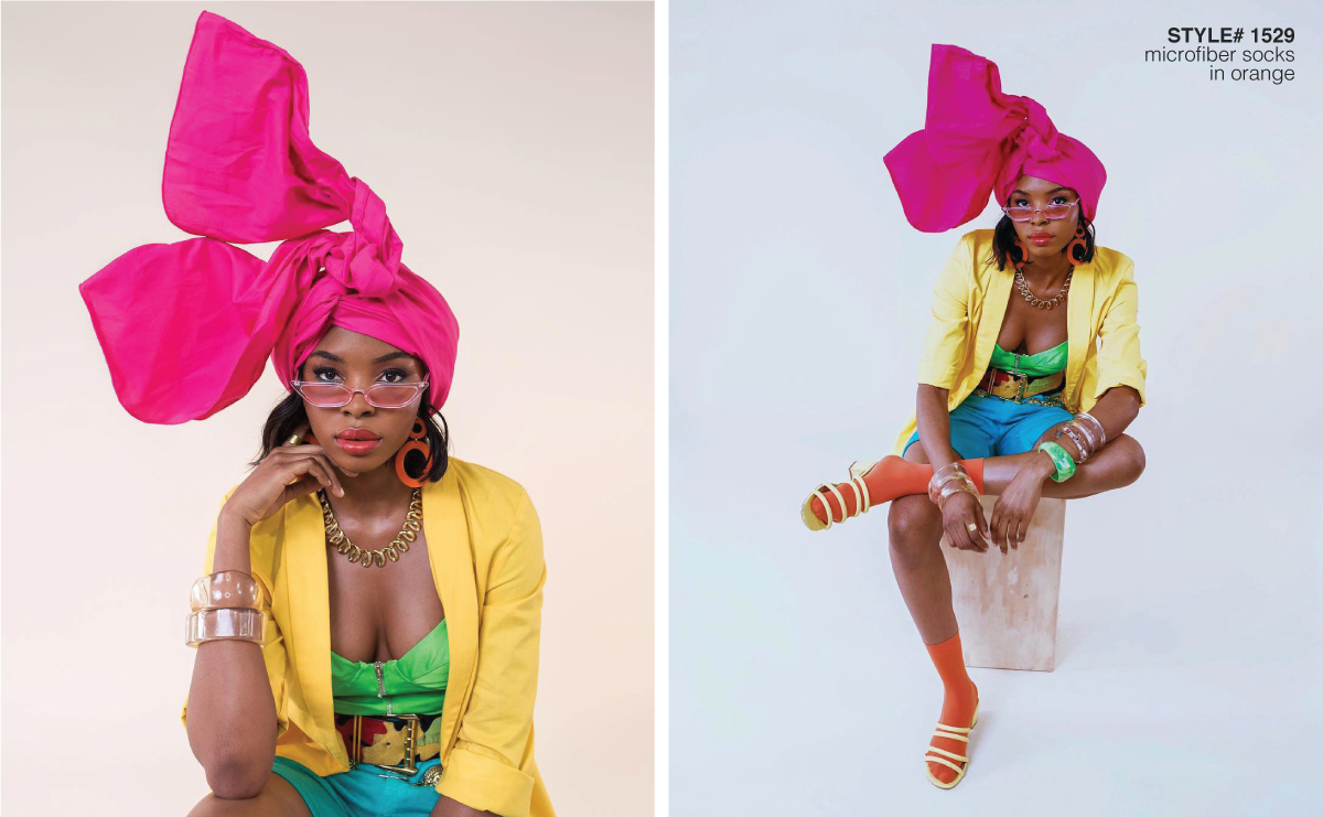 Model sitting in a chair in a white background wearing colored clothing and head wrap