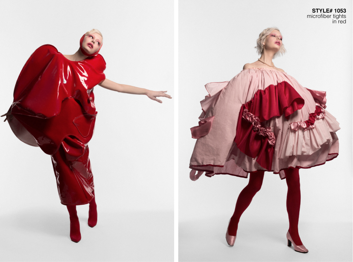 model wearing red and pink sculptured surreal garment in a white background