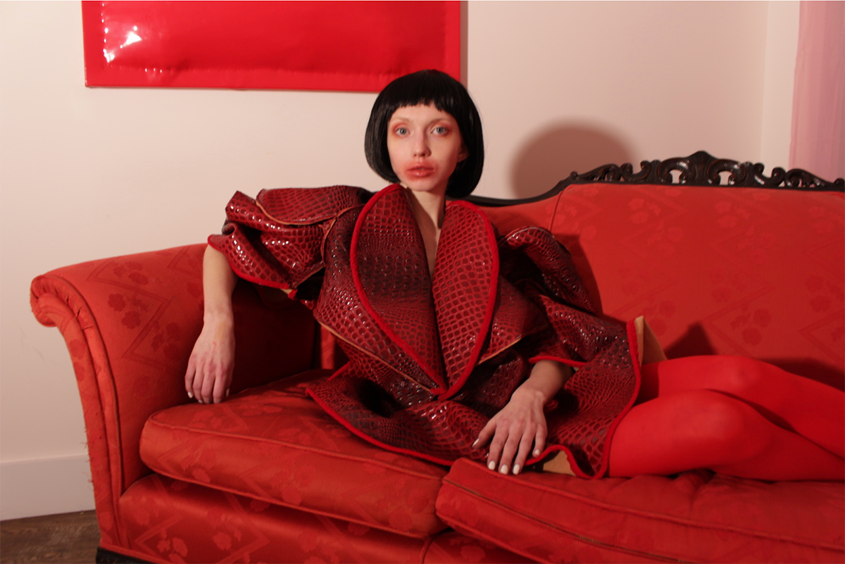 woman in red outfit on couch
